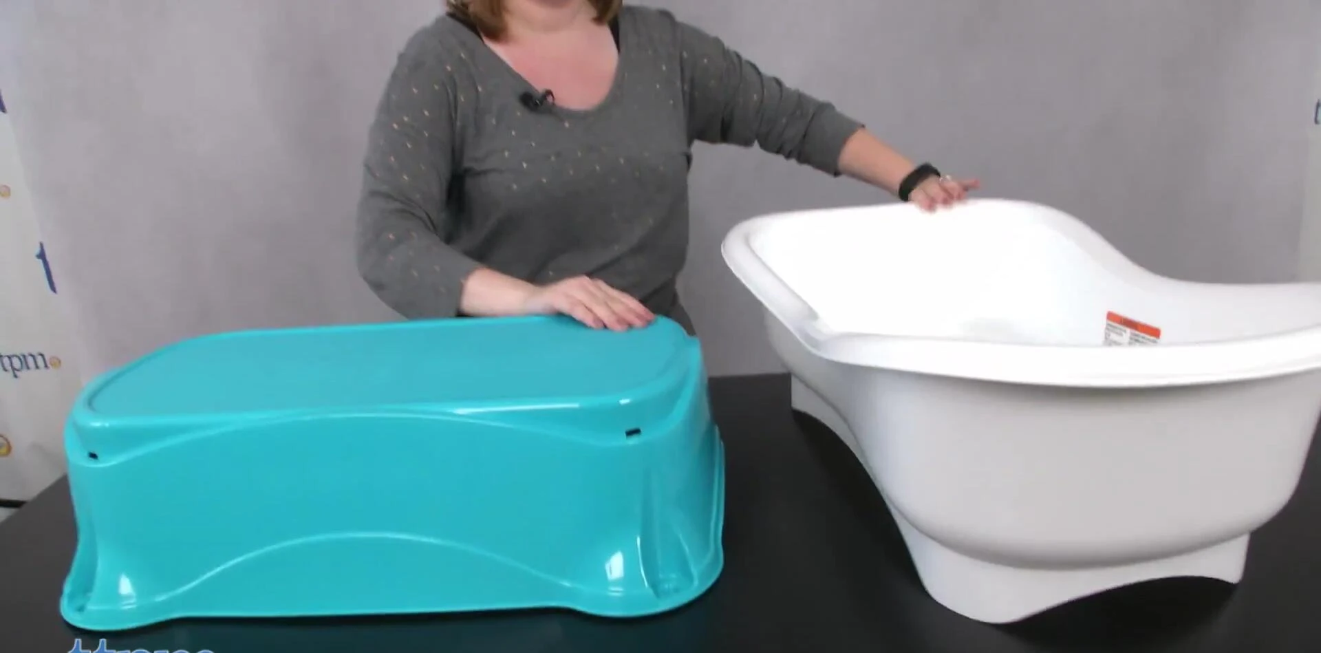 The base of the bathtub used as a kneeler for parental comfort.