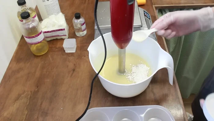 Add Additives: Add bentonite clay mixed with water, and colloidal oatmeal. Mix thoroughly with the stick blender, scraping down the sides as needed. 