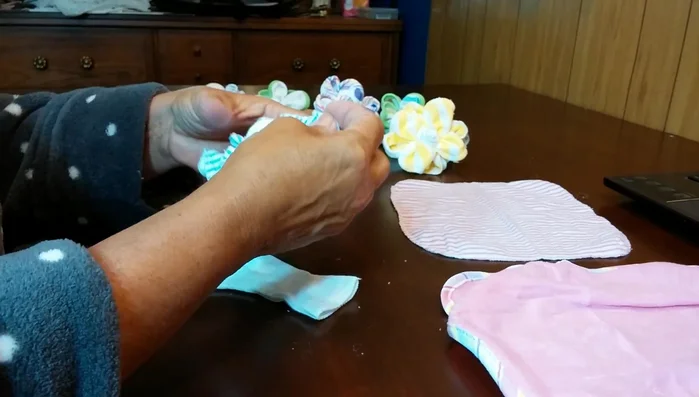 Play with the extra fabric, tucking and pulling to create ruffles and even out the flower.