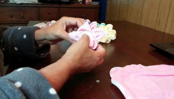 Open and shape the four points left at the base to complete the flower.