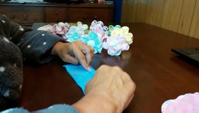 Roll or fold the washcloth tightly.