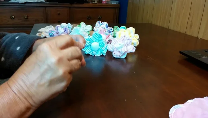 Secure the rolled washcloth with tape or a rubber band.