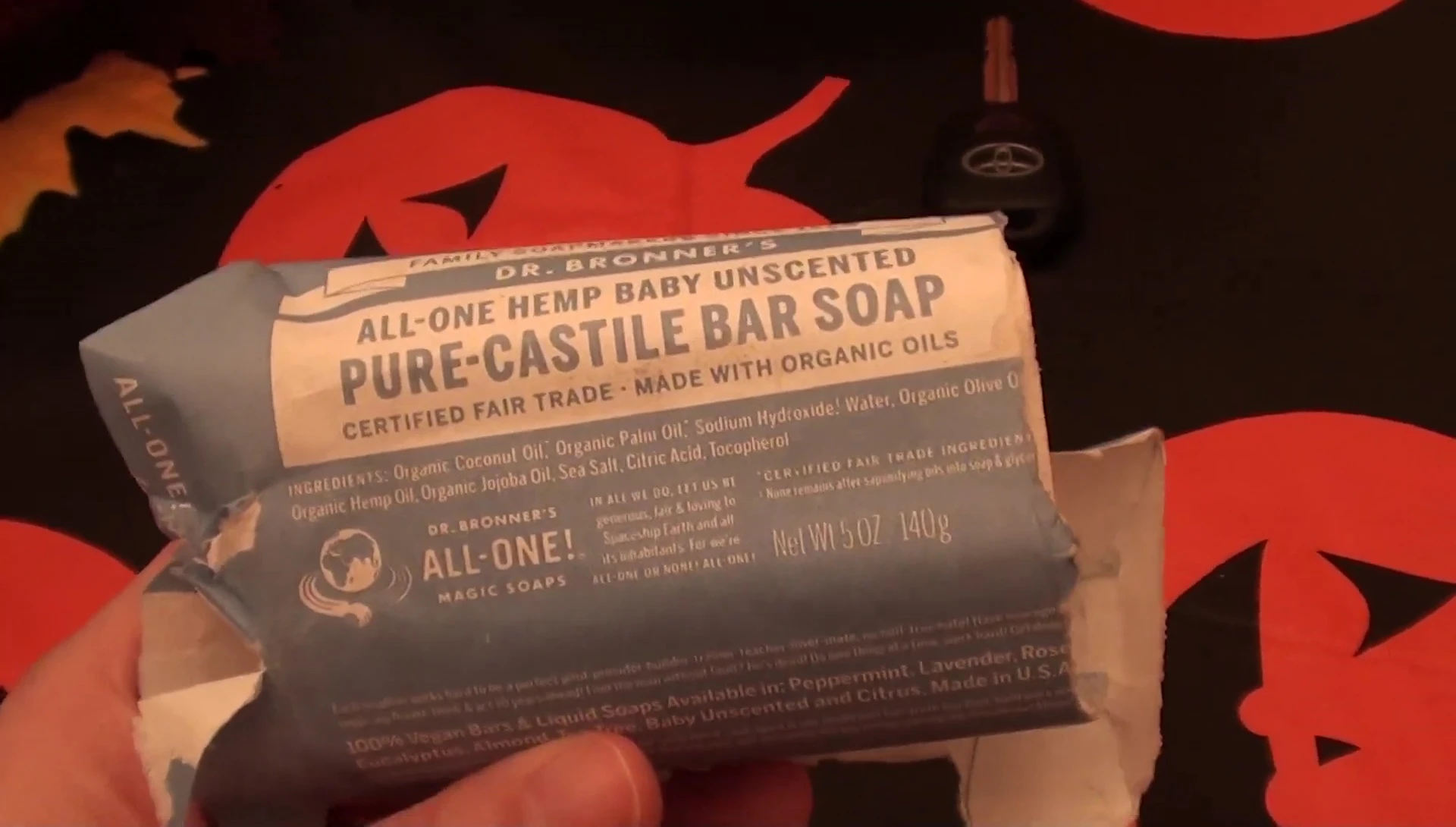 Close-up shot of the Dr. Bronner's soap bar still in its wrapper.