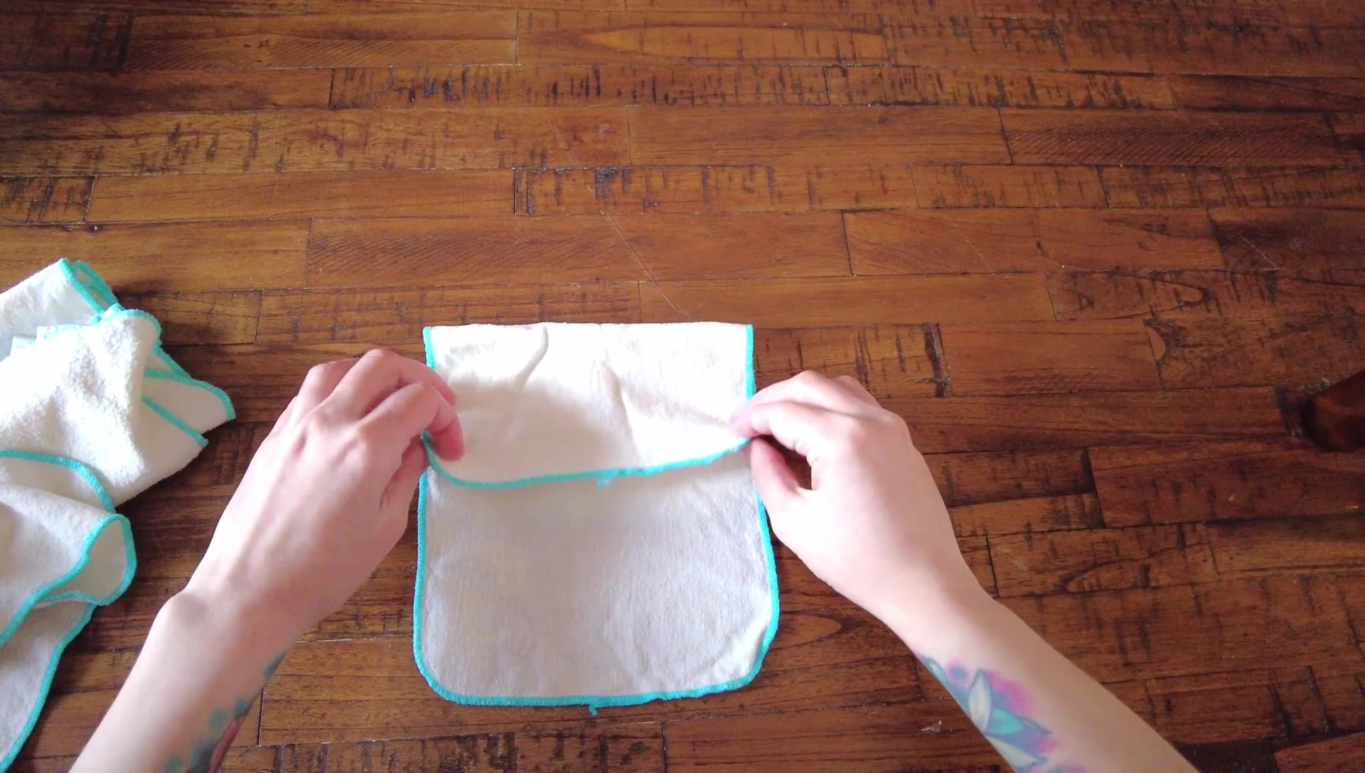 Mid-process of folding the wipes