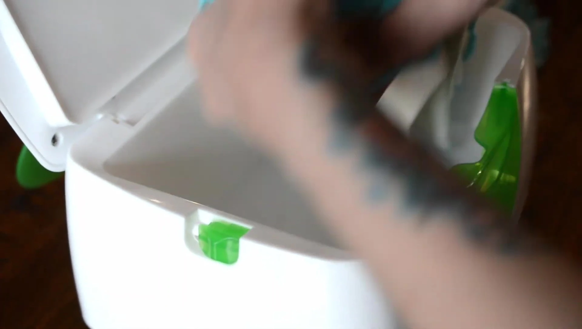 Inserting wipes into the warmer