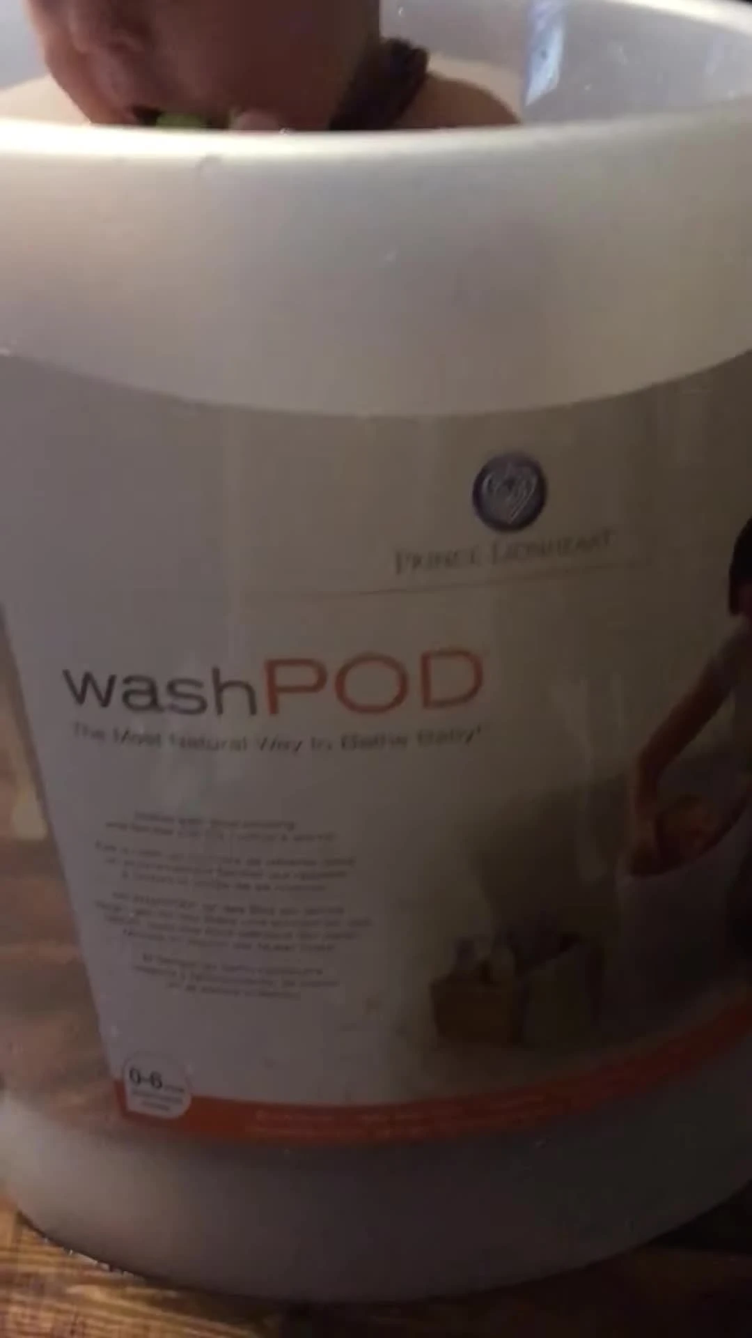 Close-up shot of the WashPod, highlighting its size and design.