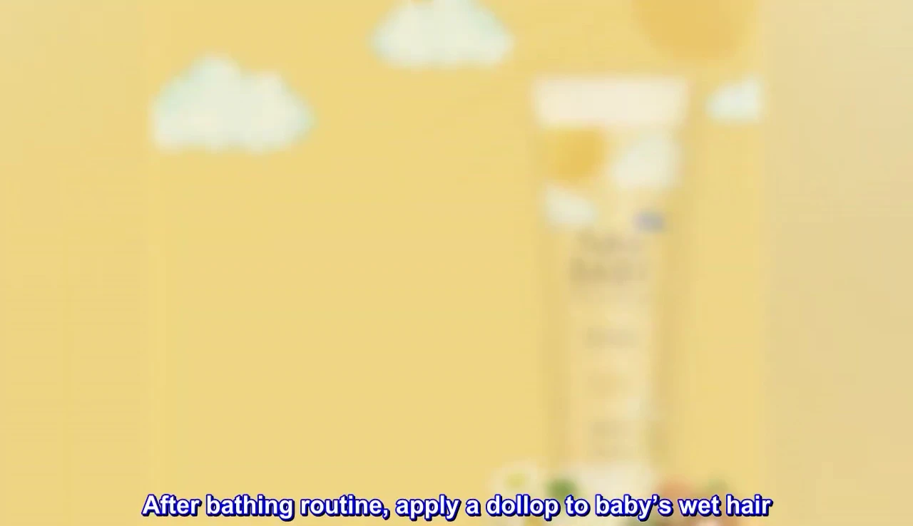 Visual demonstration of applying the conditioner to a baby's hair.