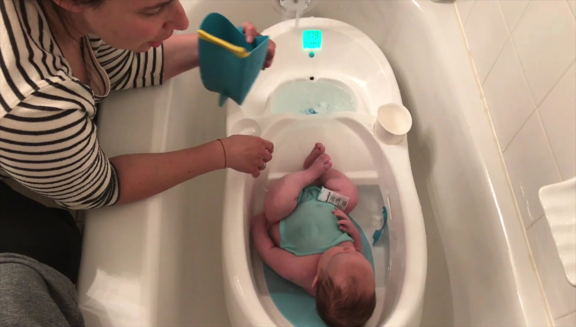 Baby enjoying a bath in the 4moms tub