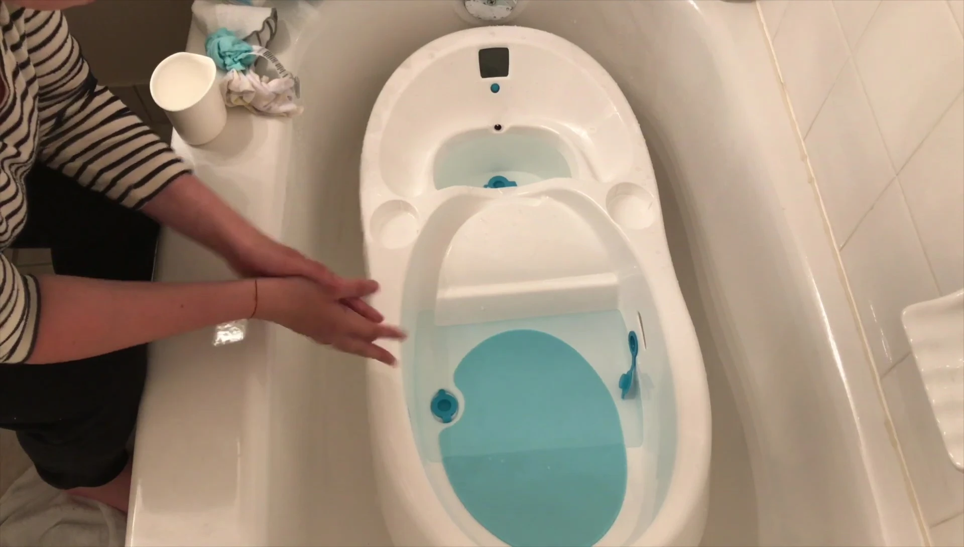 Opening the plugs to drain the water