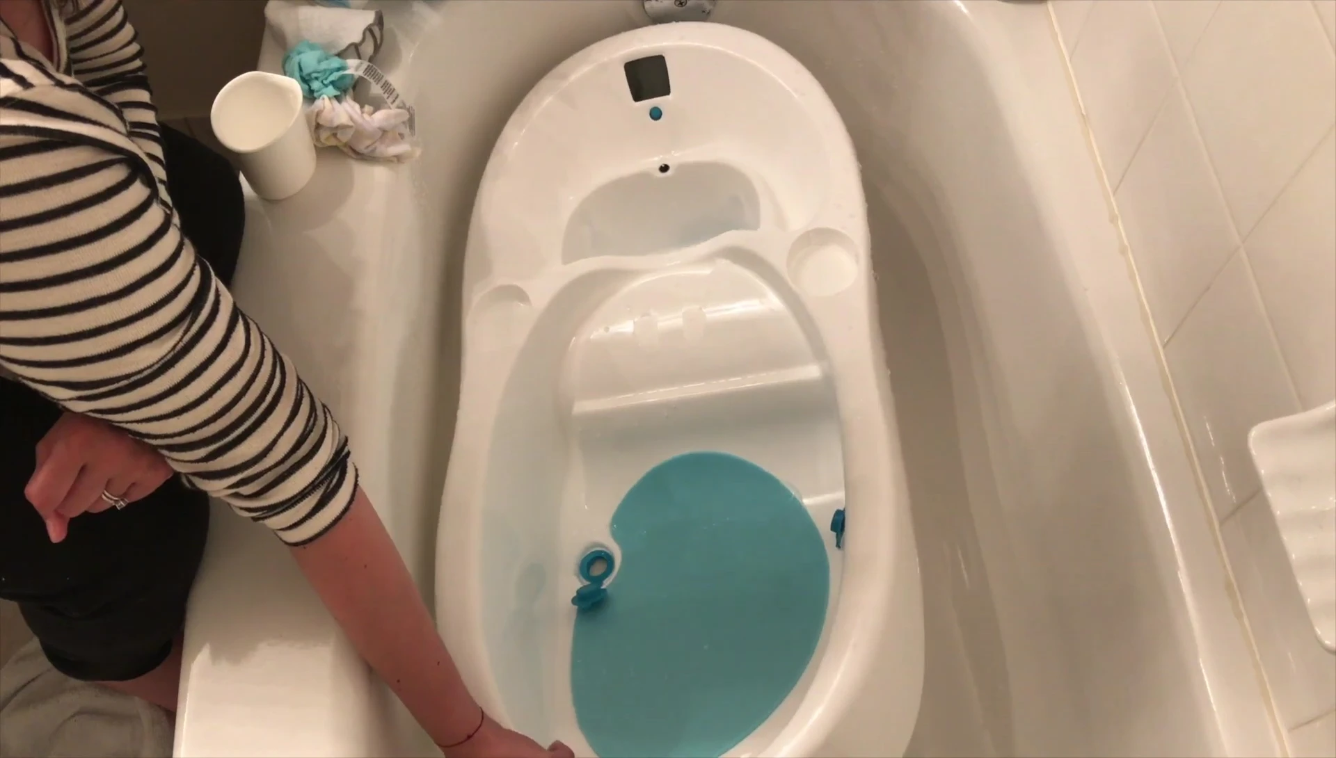 Flipping over the tub to drain out excess water