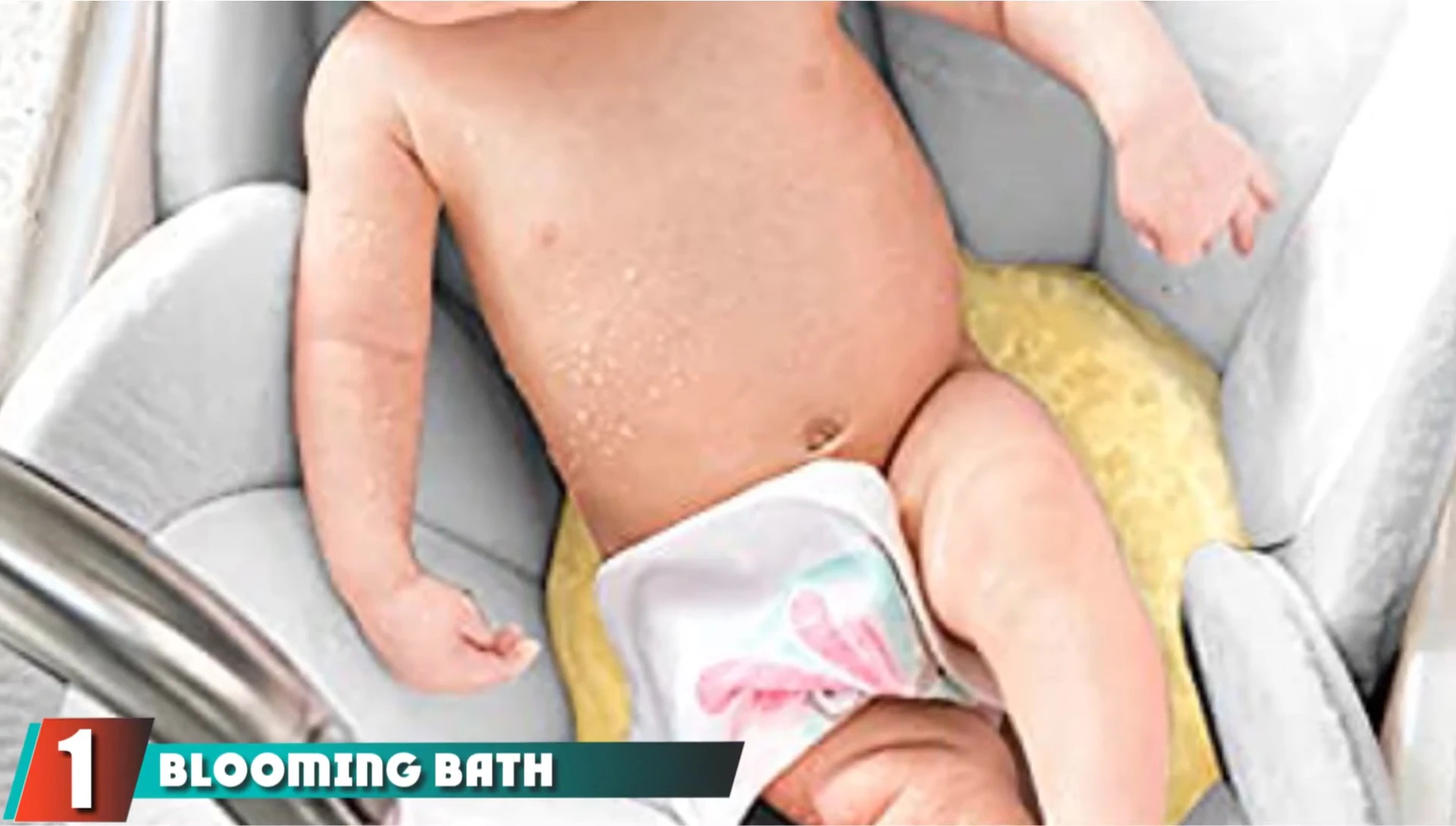 Close-up of the Blooming Bath Lotus Baby Bath Seat in a sink.