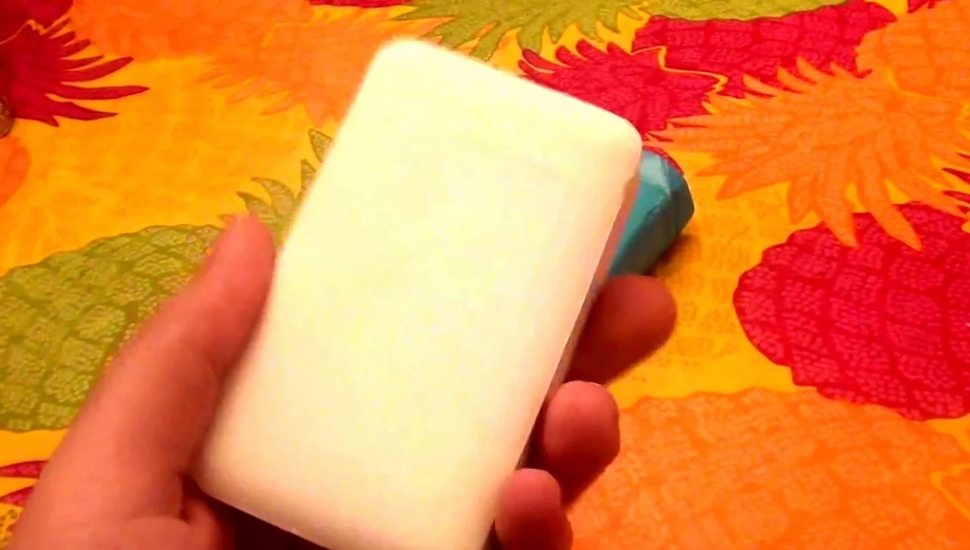 The soap being lathered in hands to show the texture