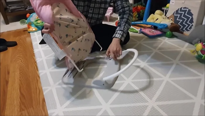 Attach the lower cover to the frame by pushing down and snapping it in.