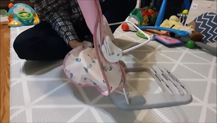 Attach the lower cover to the frame by pushing down and snapping it in.