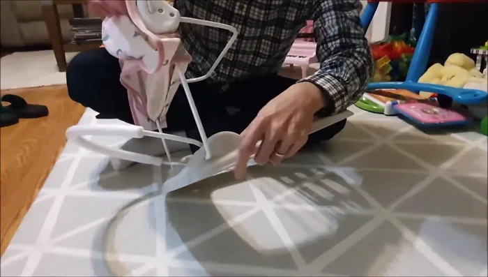 Remove the cover from the frame. Place your thumbs under the frame and push up on both sides simultaneously to release it from the grooves.