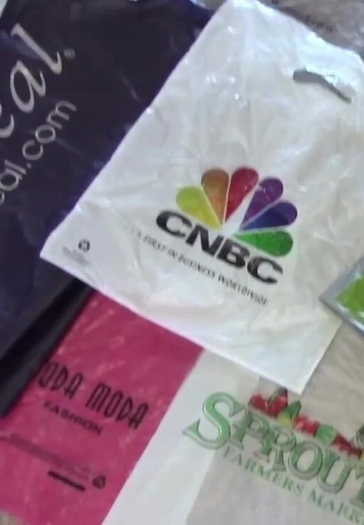 Cutting out logos and patterns from the plastic bags