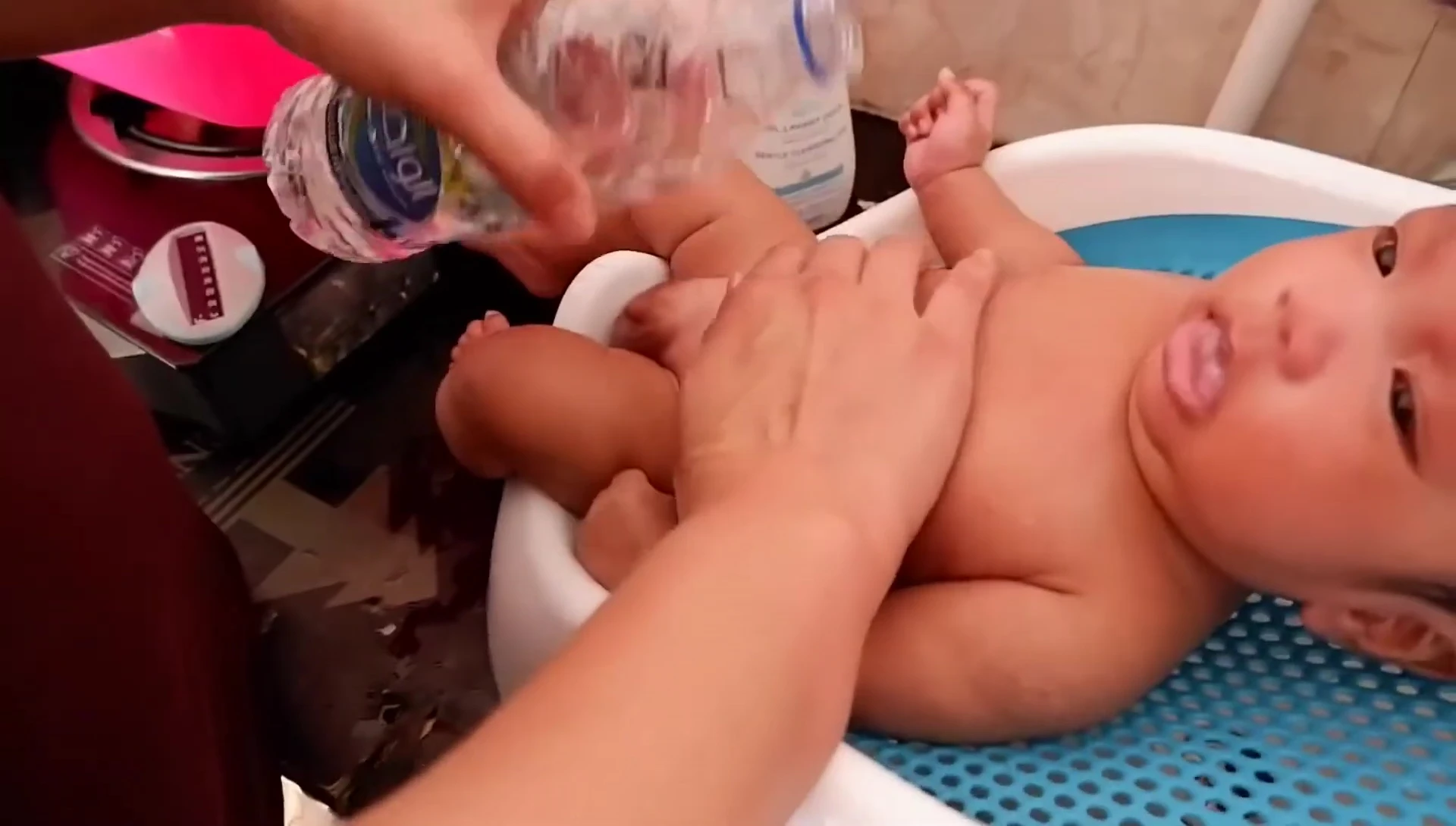 Shot showcasing the easy-to-clean nature of the bath support, maybe someone wiping it down.