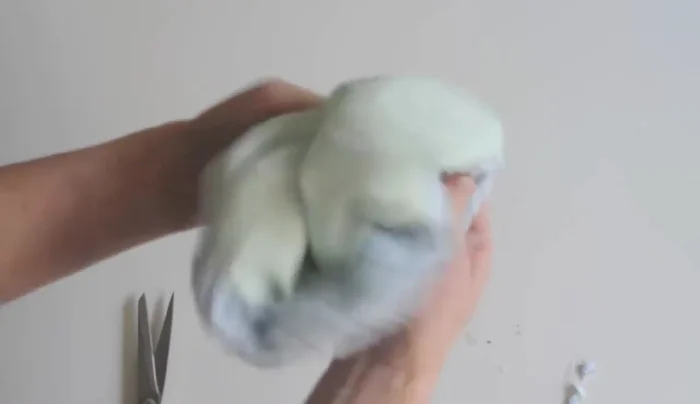 Iron the washcloth flat.