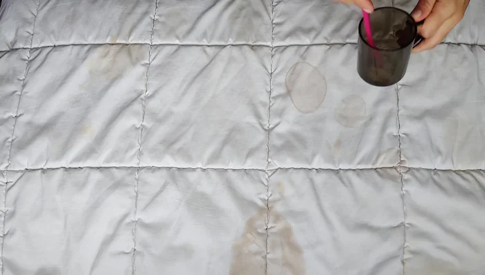 Scrub again: After 5 minutes, re-dip the brush in the solution and scrub the stains again.