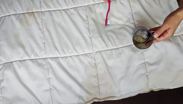 Scrub again: After 5 minutes, re-dip the brush in the solution and scrub the stains again.