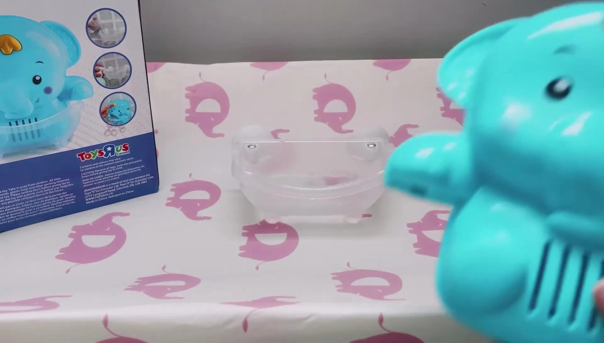 The Bubble Up Elephant toy being placed in the tub