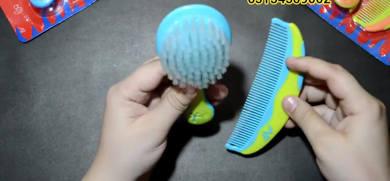 Close-up view of the soft bristles of the baby hair brush.