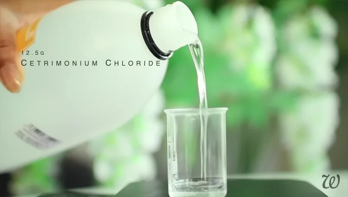 Prepare the water phase for the leave-in conditioner: combine distilled water, peppermint hydrosol (optional), centromonium chloride, and guar gum. Whisk until combined.