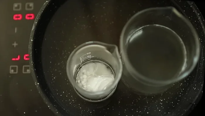 Combine the oil and water phases for the leave-in conditioner. Whisk thoroughly until fully emulsified.