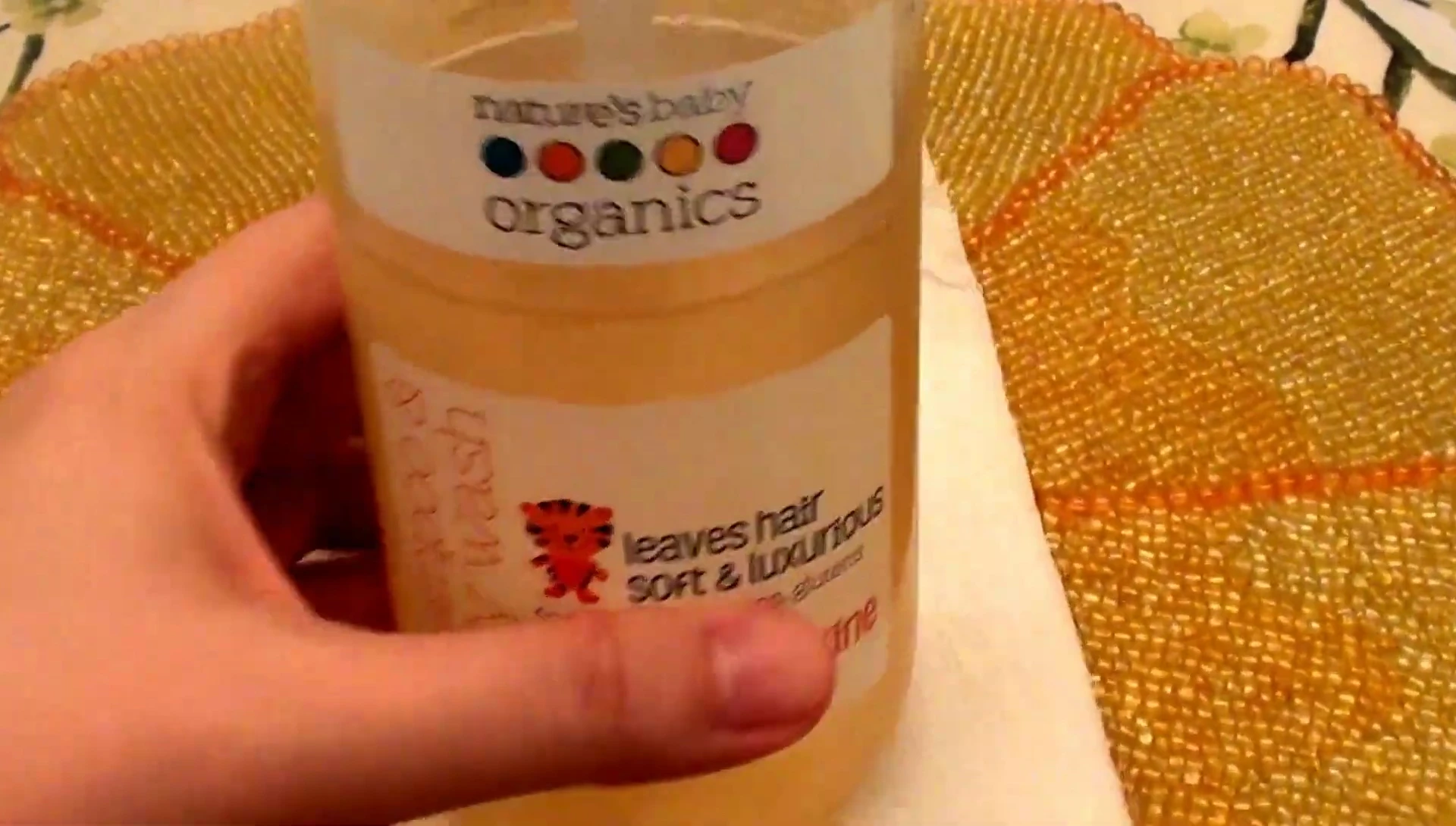The shampoo bottle showcasing the brand name.