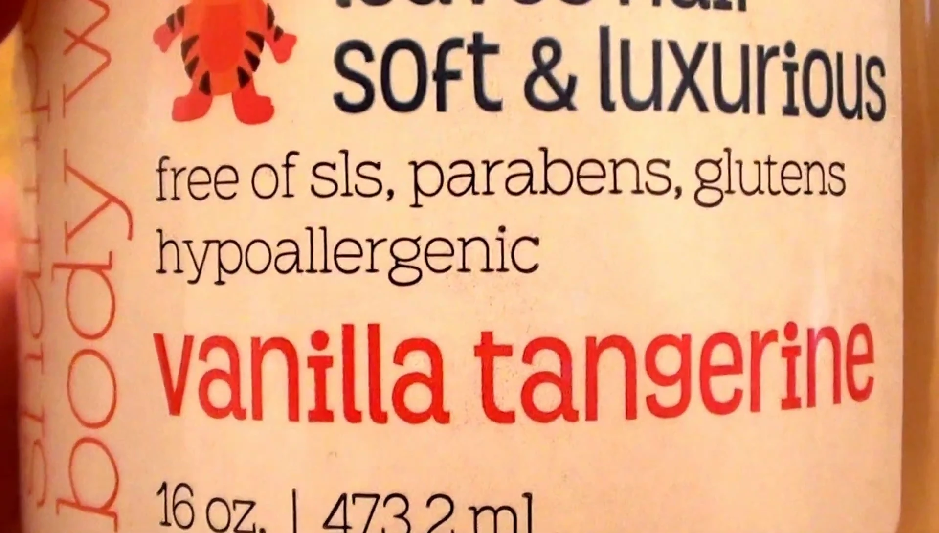 Close-up shot highlighting the product's 'free of' claims.
