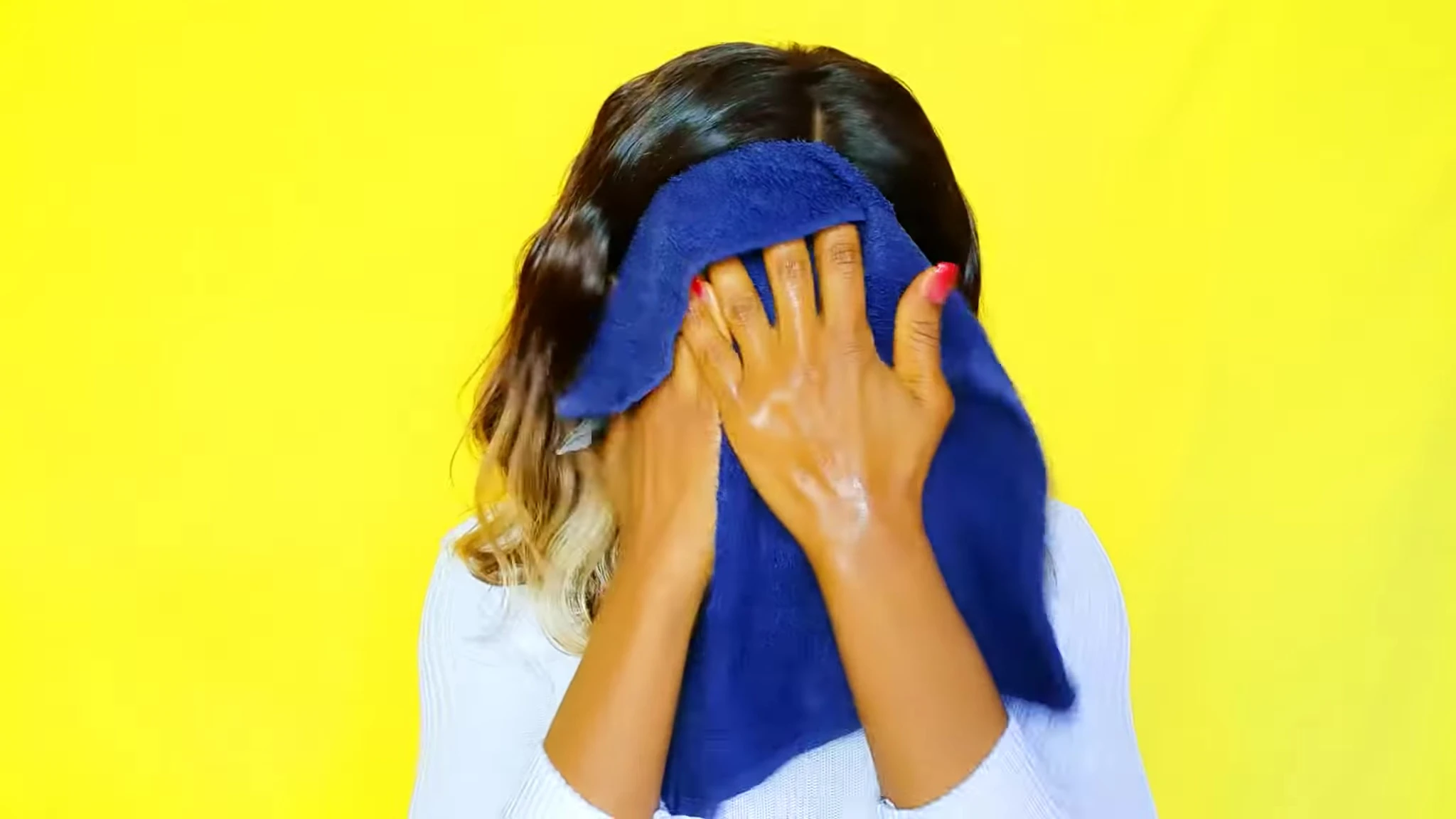 Speaker demonstrating the process of washing their face