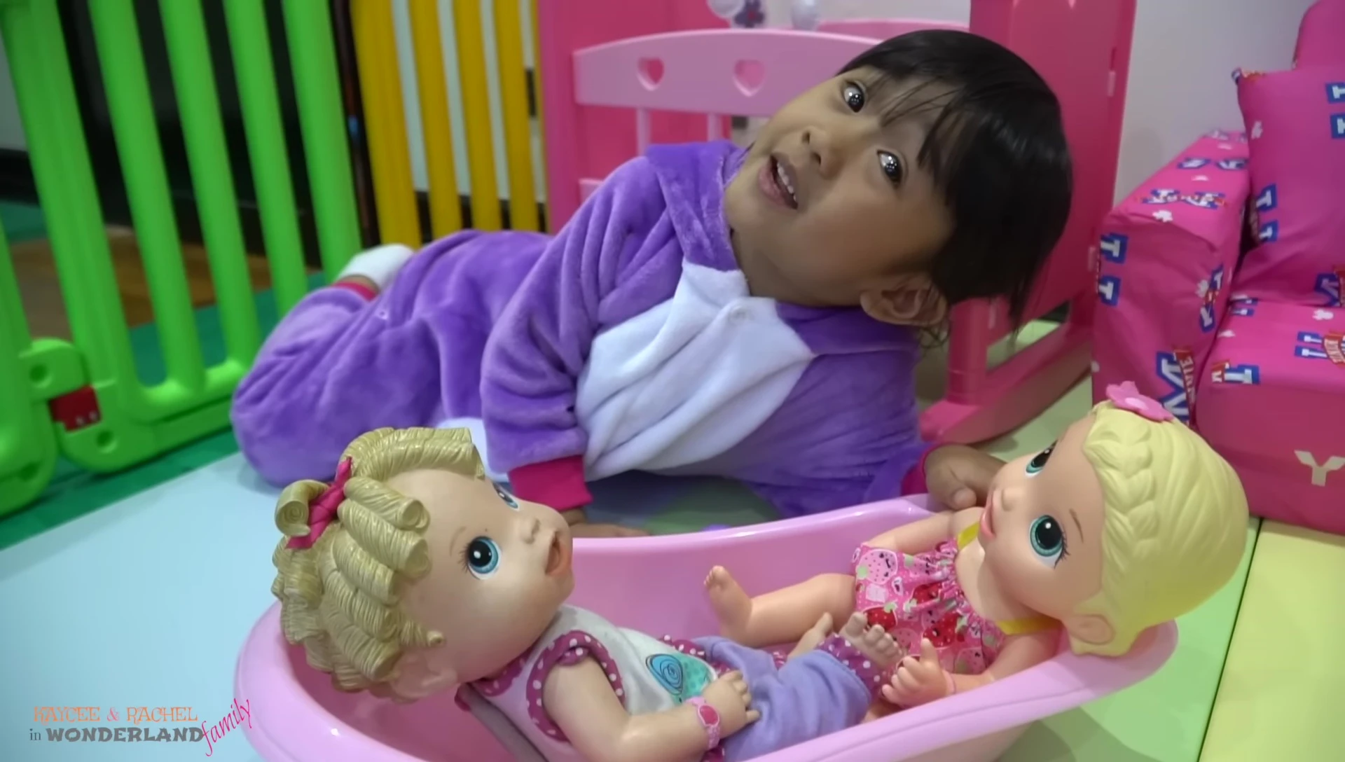 Rachel drying the baby doll with a towel.