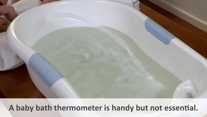 Prepare the bathwater: Use warm water (test with wrist/elbow); add baby bath liquid later (if not first bath).
