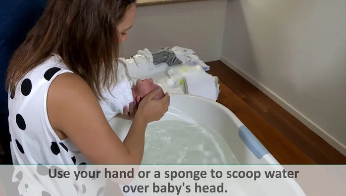 Wash head and body: Gently pour water over baby's head (being mindful of the fontanel); wash body.