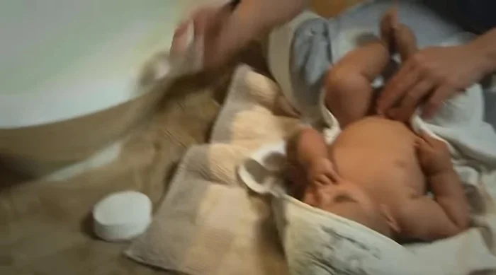 Clean your baby's bottom: Use clean cotton wool dipped in water to wipe your baby's bottom, ensuring you clean between the folds and dry thoroughly.