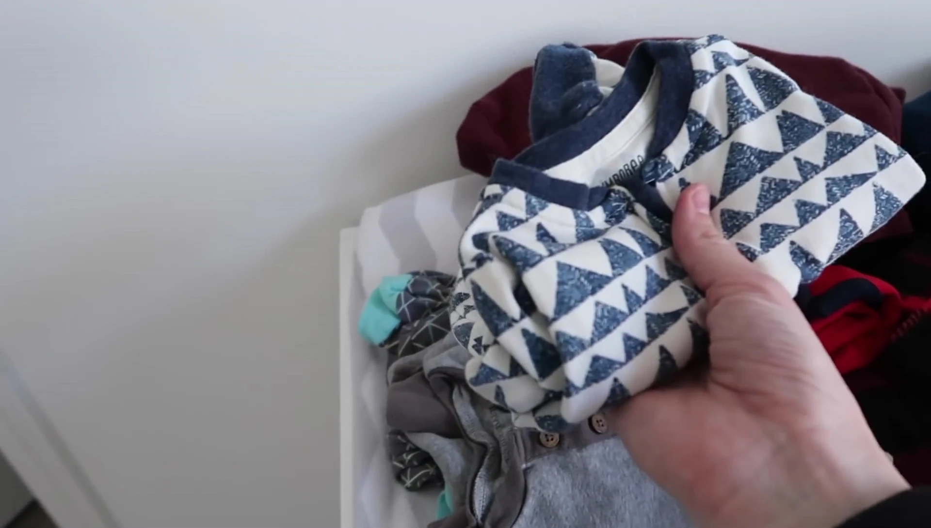 Stack of baby clothes.