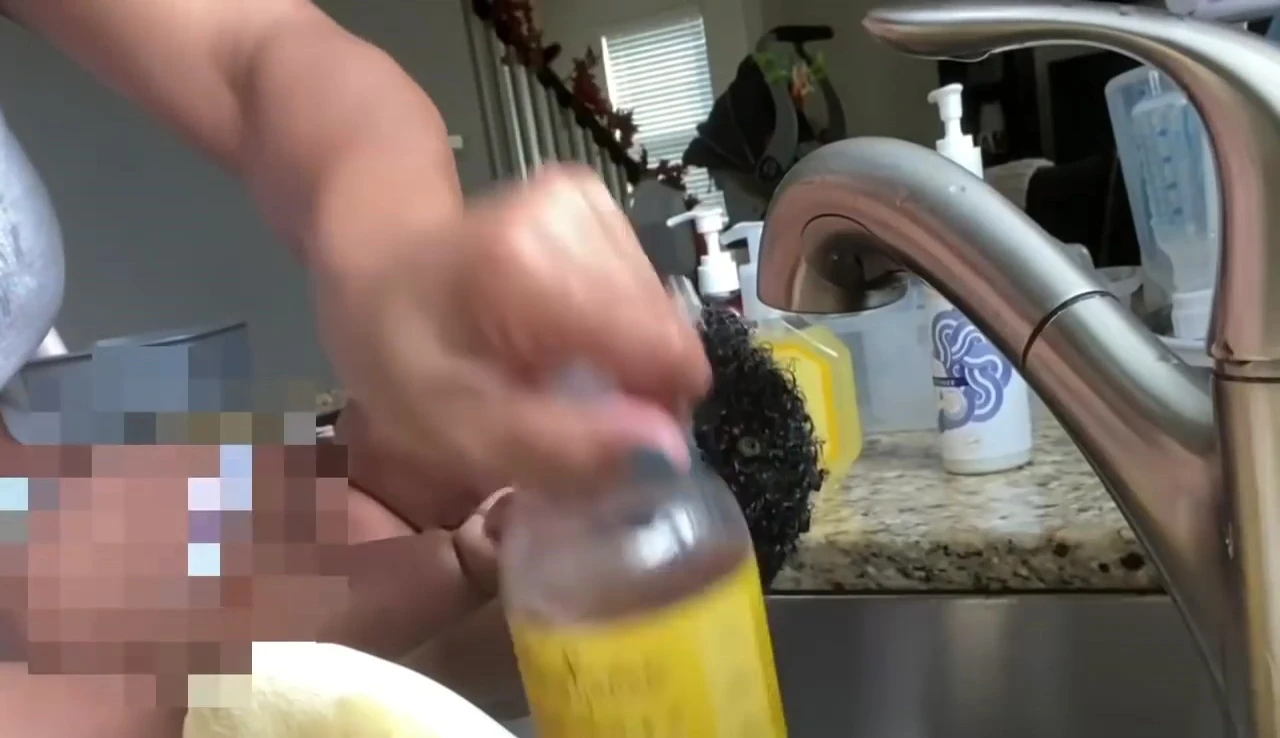 Applying Shea Moisture baby shampoo