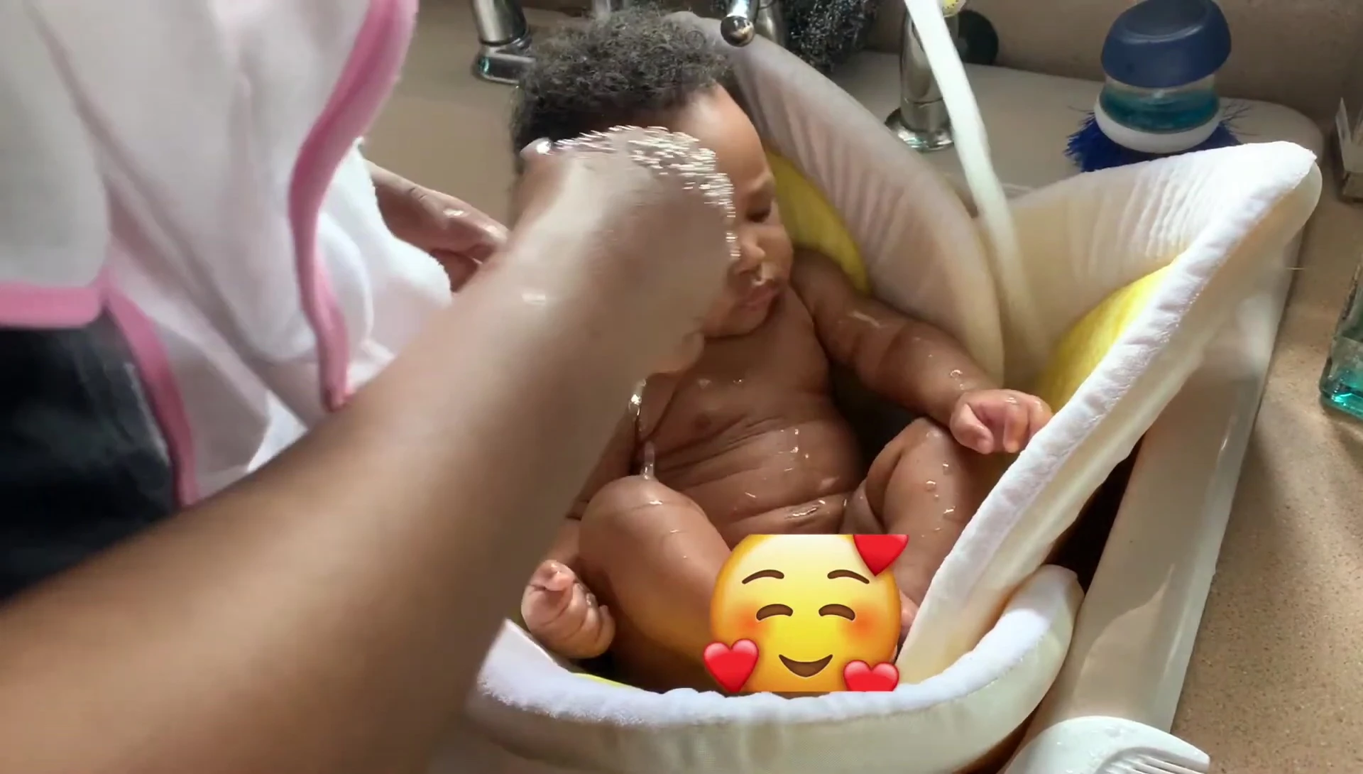Close-up of the baby in the Blooming Baby Bathtub, showing the petal support