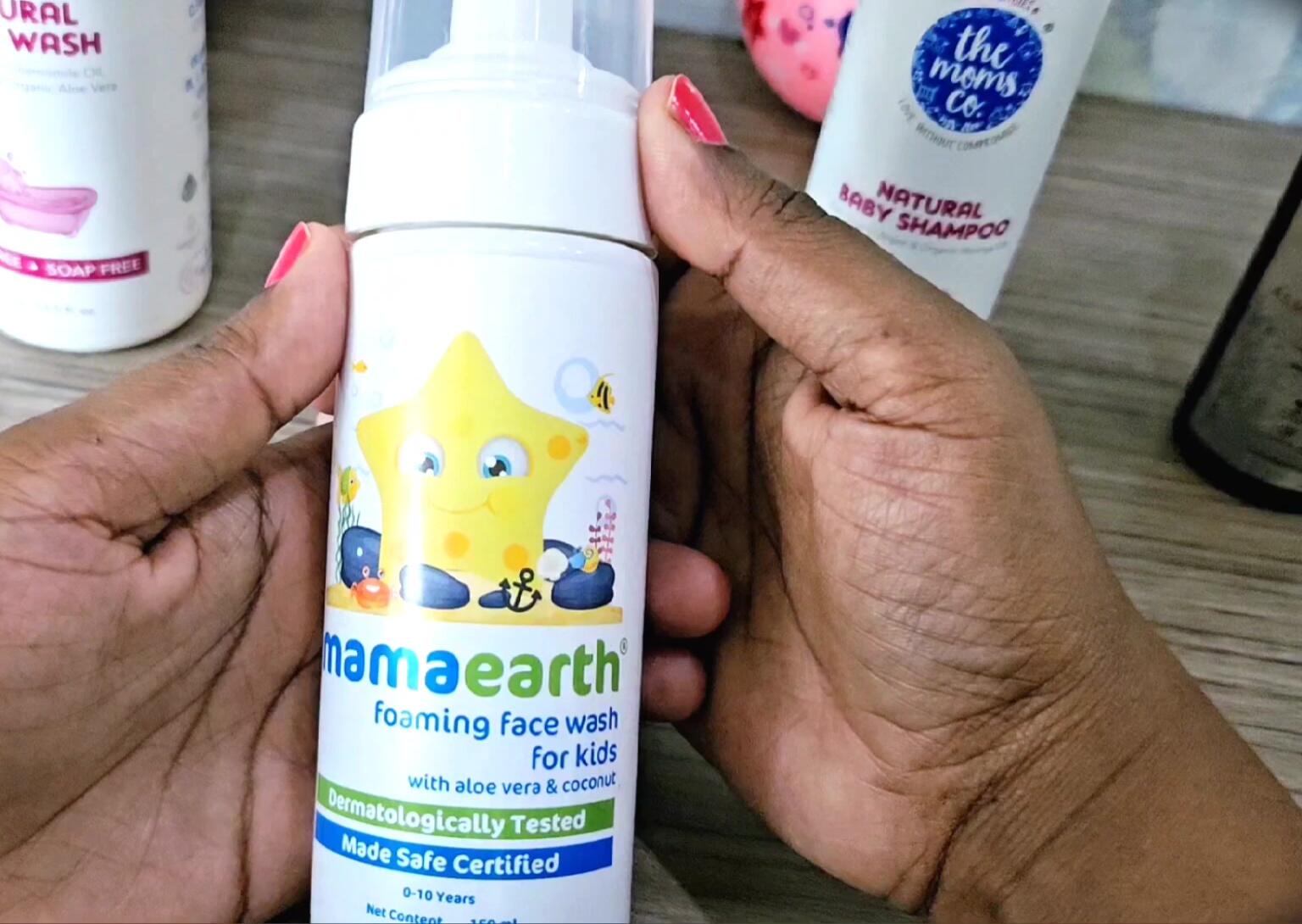 Product shot of Mama Earth's Baby Face Wash bottle