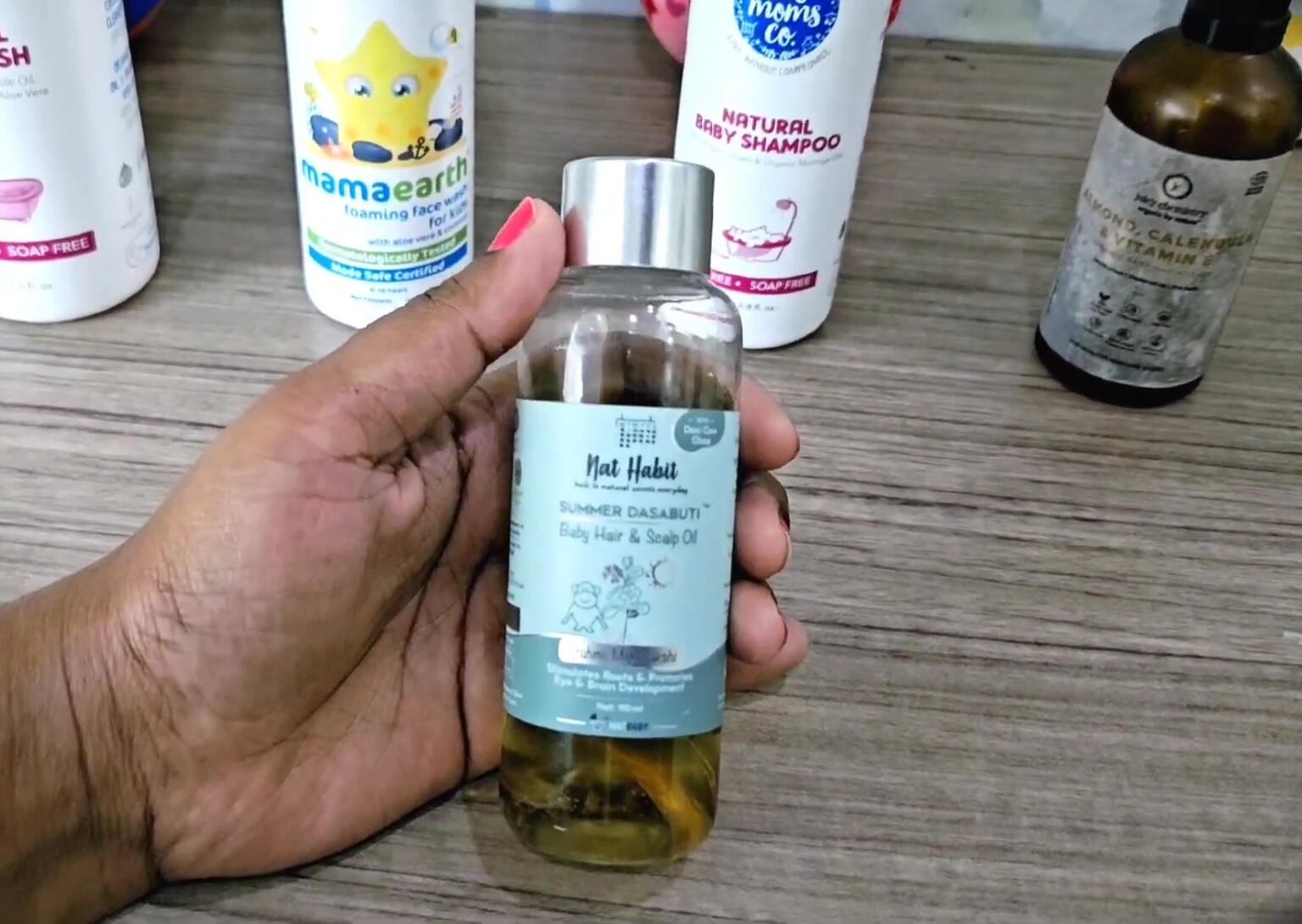 Product shot of Net Habit's Summer Baby Scalp Hair Oil bottle