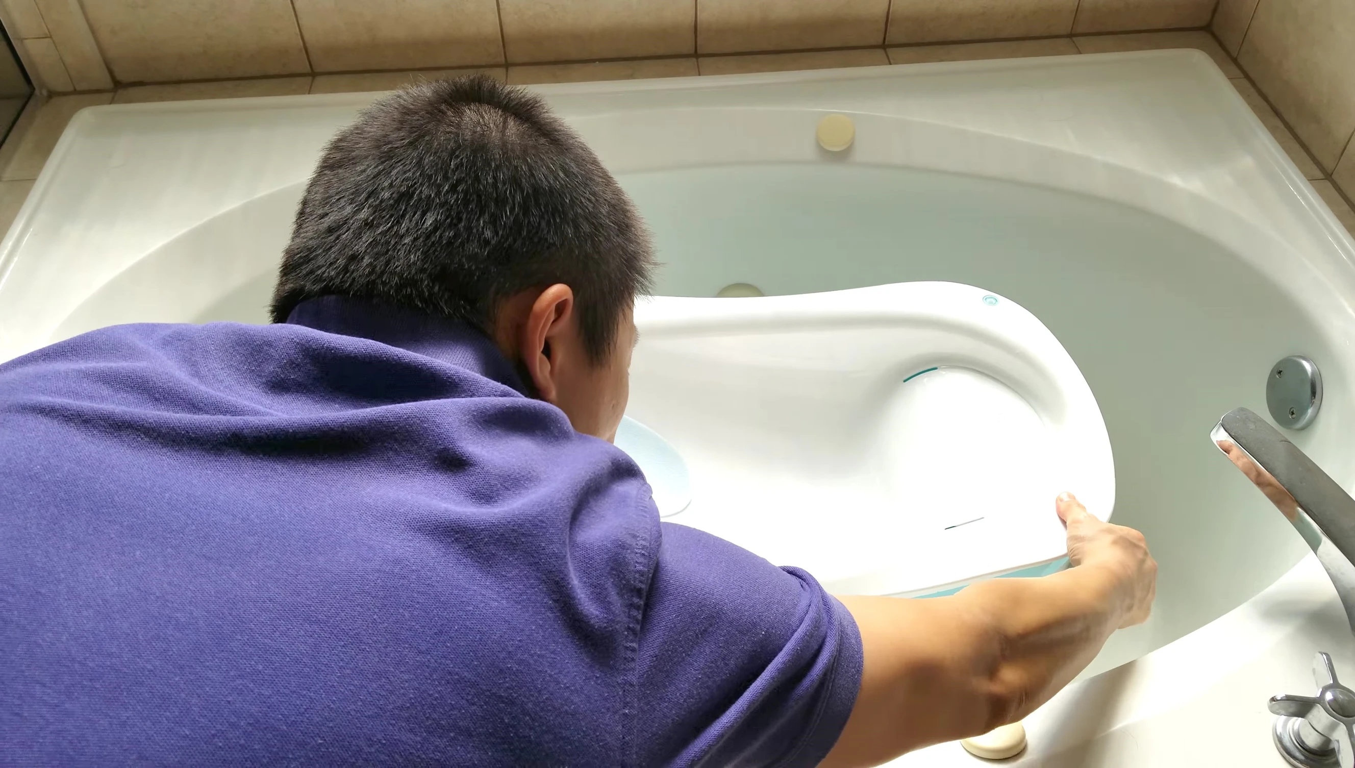 Baby sitting in the Summer Infant Right Height Bathtub