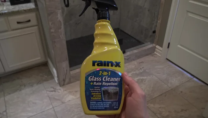 Spray Rain-X onto one pane at a time, buff with a microfiber cloth