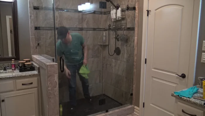 Spray Rain-X onto one pane at a time, buff with a microfiber cloth