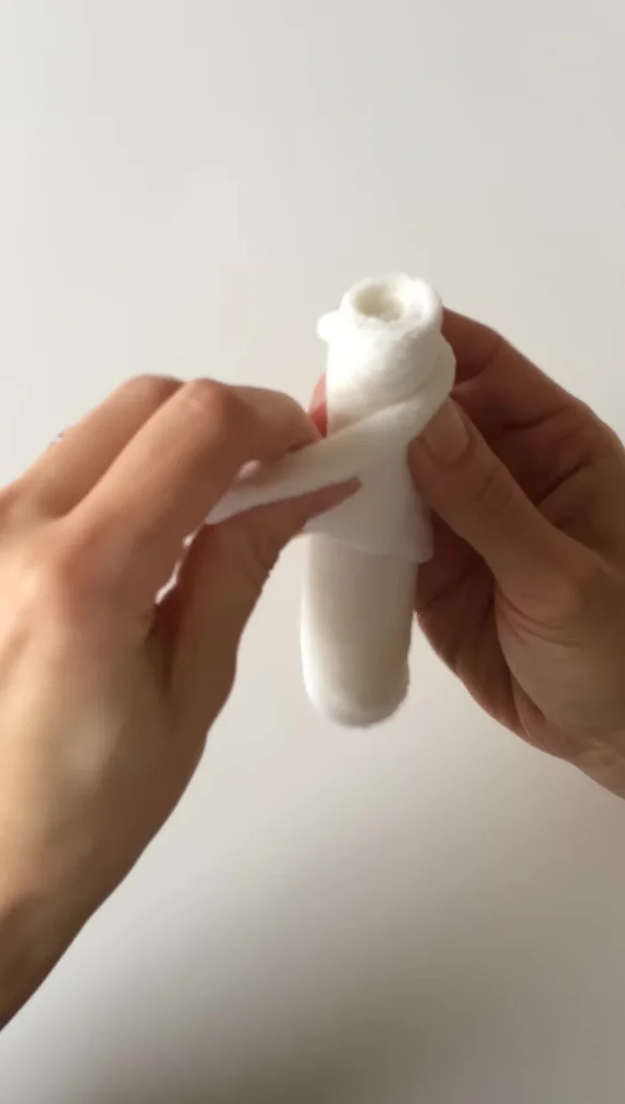 Turn and fold the back around to the front to secure the rosebud shape.