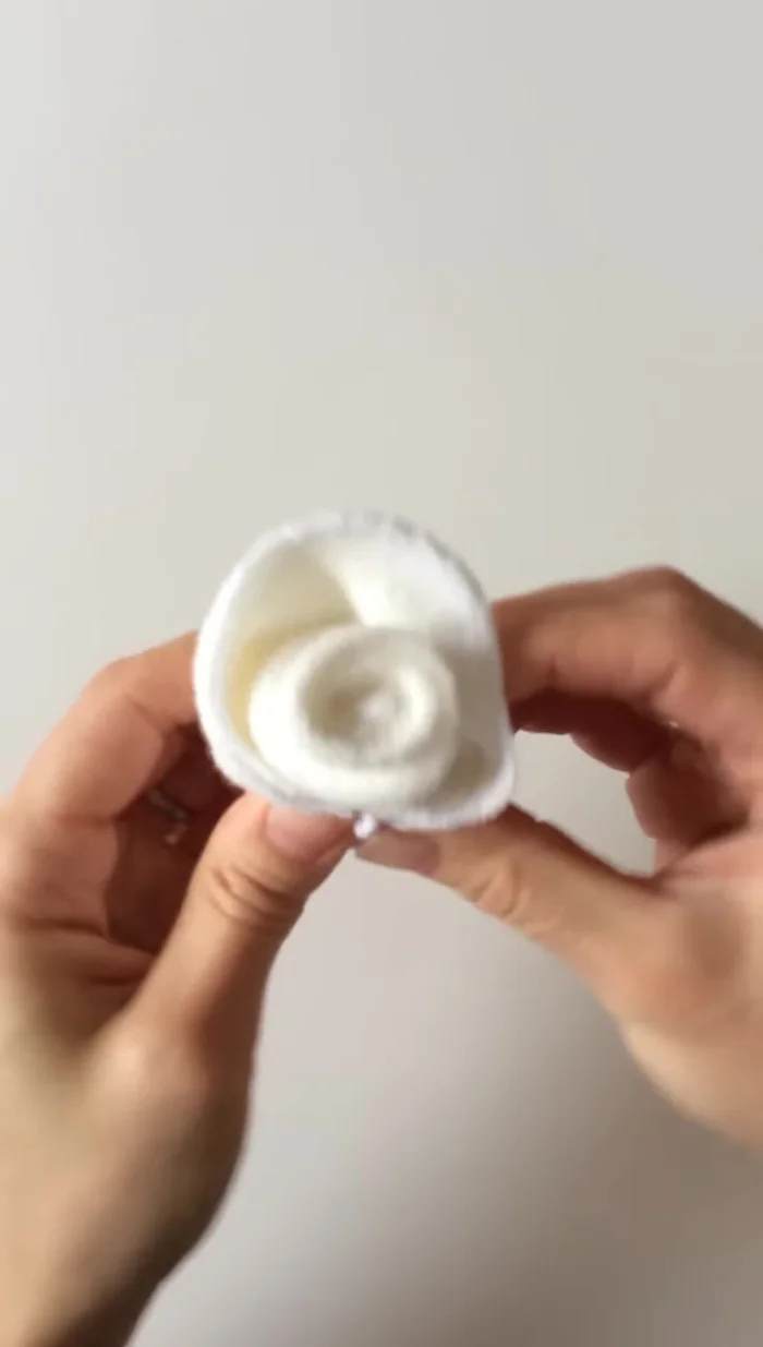 Fold the petals down to complete the rosebud.