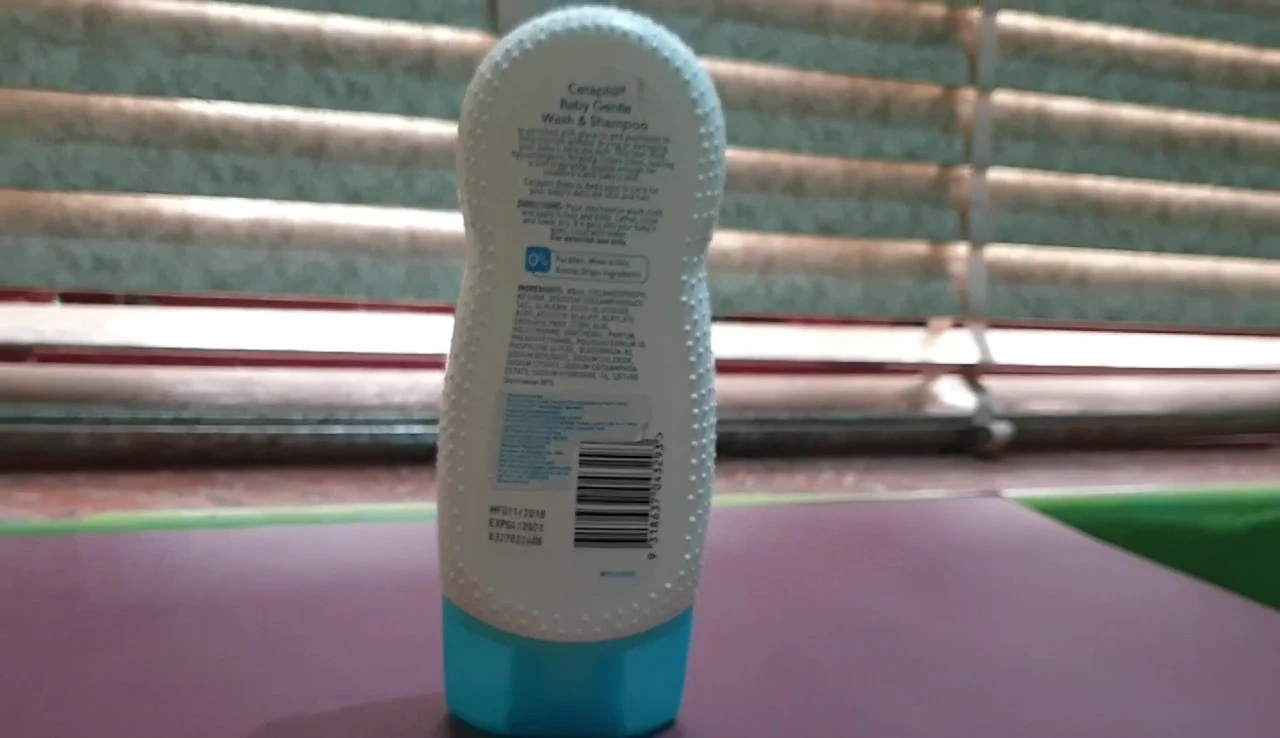 Shot of the product being applied, demonstrating its creamy texture.