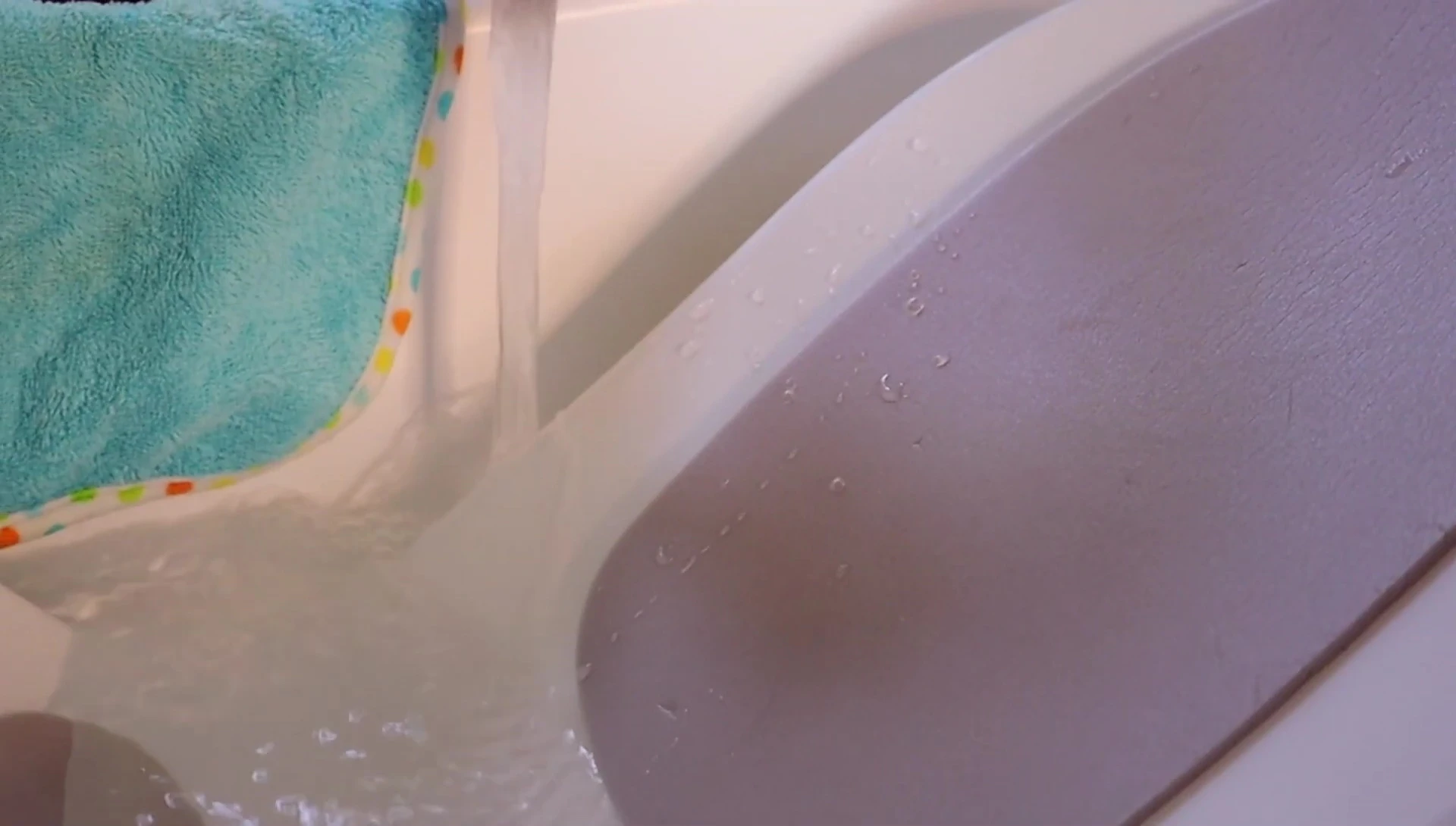 Person turning on the water tap.