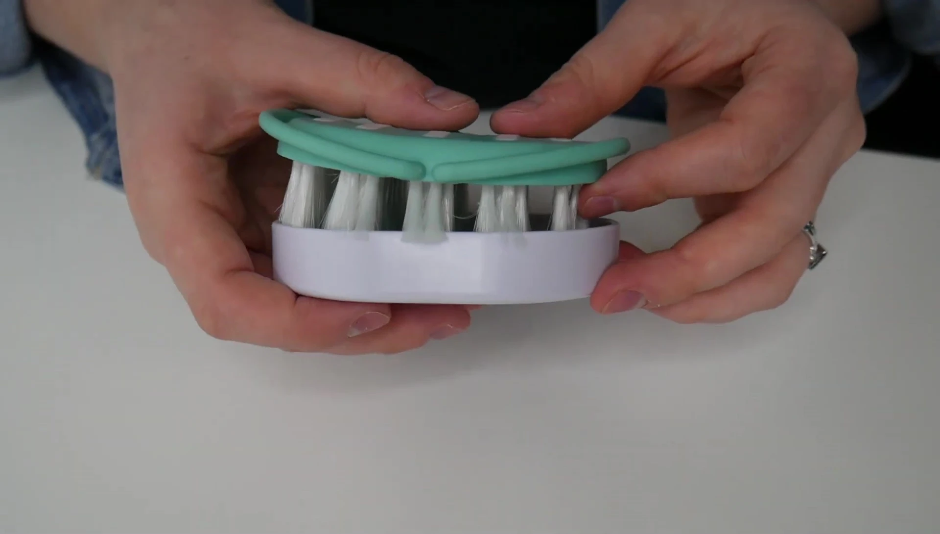 The hairbrush and comb neatly stored in the carrying case.