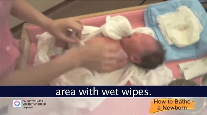 Clean diaper area: If soiled, clean the diaper area with wet wipes. Wash hands afterward.