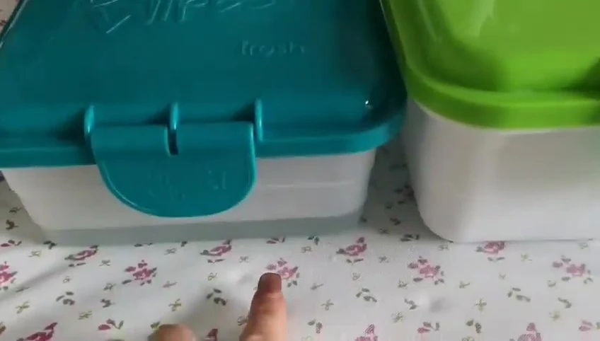 Adding warm water to the fresh wipes container.